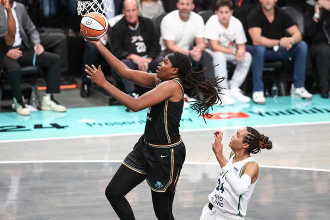 Liberty forward Jonquel Jones drives past Lynx forward Napheesa Collier in the second quarter.