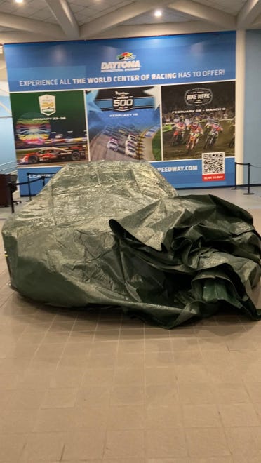 Hours after Hurricane Milton made landfall near Siesta Key, Florida, the storm's winds caused a 30-foot piece of skylight to fall from the roof of the Melbourne Orlando International Airport (across the state) at 2 a.m. Thursday, Oct. 10, 2024. Greg Donovan, executive director of Melbourne Orlando International Airport, said a NASCAR vehicle on display avoided a direct hit from the busted skylight nearby.