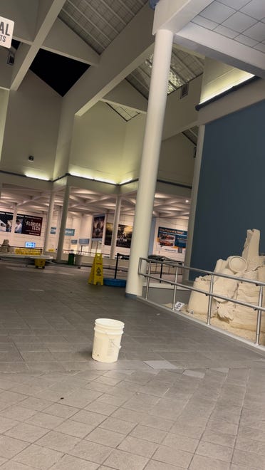 Hours after Hurricane Milton made landfall near Siesta Key, Florida, the storm's winds caused a 30-foot piece of skylight to fall from the roof of the Melbourne Orlando International Airport (across the state) at 2 a.m. Thursday, Oct. 10, 2024. The hole in the roof was 30-by-40 feet and can be seen in the background, according to Greg Donovan, executive director of Melbourne Orlando International Airport.