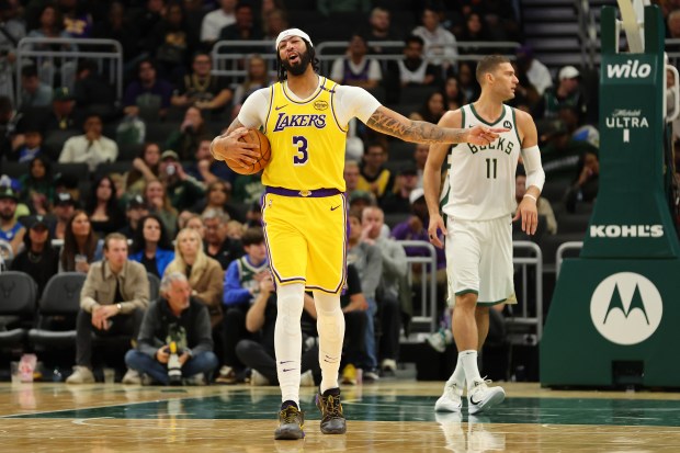 Lakers star Anthony Davis reacts to an official’s call during...