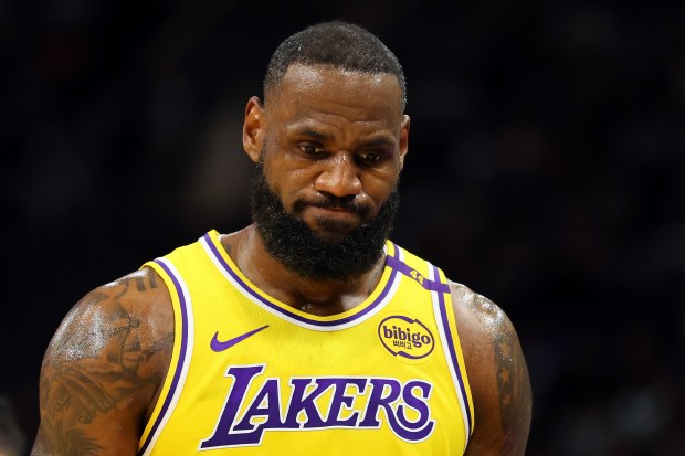 Lakers star LeBron James walks back down the court during...