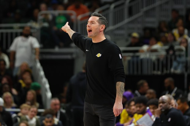 Lakers head coach JJ Redick reacts to an official’s call...