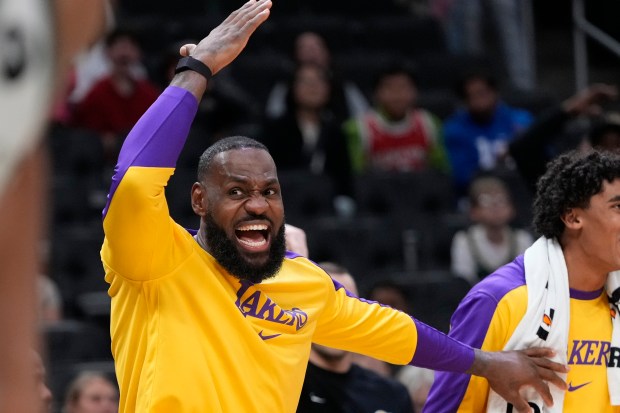 Lakers star LeBron James reacts on the sideline during the...