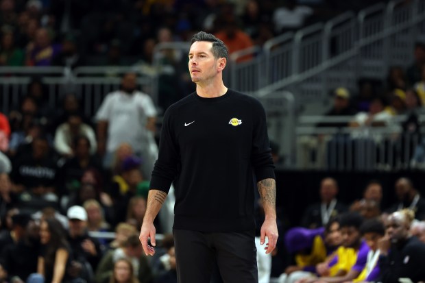 Lakers head coach JJ Redick reacts to an official’s call...