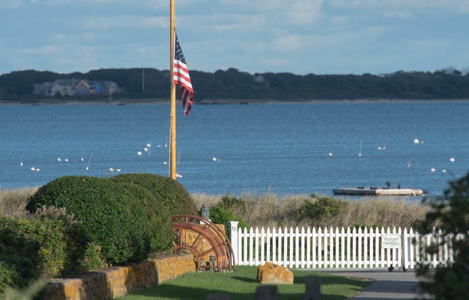 The late afternoon sun sets over the Kennedy compound in Hyannisport on Oct. 10, 2024, where the flag was put to half-mast after the death of Ethel Kennedy.