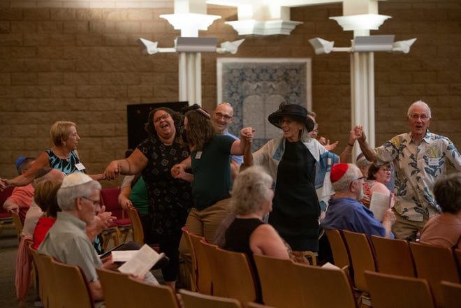 Temple Chai guests dance to music on Shabbat Shuvah, the service between Rosh Hashana and Yom Kippur, at Temple Chai in Phoenix on Sept. 30, 2022.