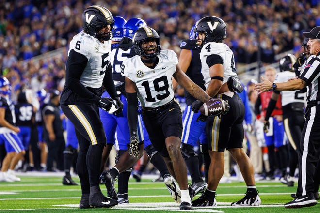 Oct 12, 2024; Lexington, Kentucky, USA; Vanderbilt Commodores safety De'Rickey Wright (19) celebrates after an interception against the Kentucky Wildcats during the third quarter at Kroger Field. Mandatory Credit: Jordan Prather-Imagn Images