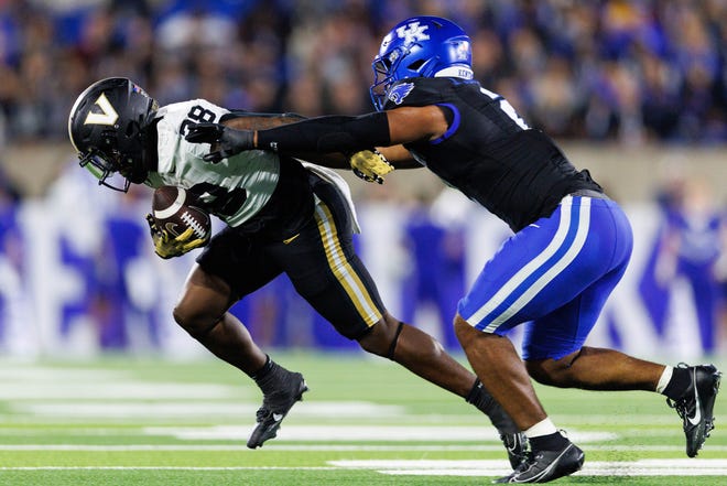 Oct 12, 2024; Lexington, Kentucky, USA; Kentucky Wildcats linebacker Jamon Dumas-Johnson (2) pushes Vanderbilt Commodores running back Sedrick Alexander (28) out of bounds during the fourth quarter at Kroger Field. Mandatory Credit: Jordan Prather-Imagn Images