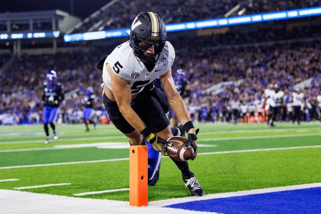 Oct 12, 2024; Lexington, Kentucky, USA; Vanderbilt Commodores wide receiver Richie Hoskins (5) dives into the end zone for a touchdown against the Kentucky Wildcats during the second quarter at Kroger Field. Mandatory Credit: Jordan Prather-Imagn Images