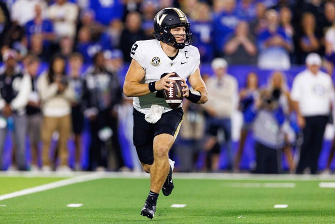 Oct 12, 2024; Lexington, Kentucky, USA; Vanderbilt Commodores quarterback Diego Pavia (2) looks for a receiver against the Kentucky Wildcats during the first quarter at Kroger Field. Mandatory Credit: Jordan Prather-Imagn Images