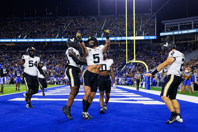 Oct 12, 2024; Lexington, Kentucky, USA; Vanderbilt Commodores wide receiver Richie Hoskins (5) celebrates after scoring a touchdown against the Kentucky Wildcats during the second quarter at Kroger Field. Mandatory Credit: Jordan Prather-Imagn Images