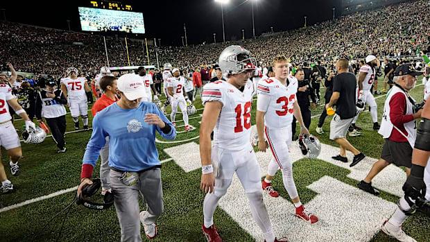 Oct 12, 2024; Eugene, Oregon, USA; Ohio State Buckeyes quarterback Will Howard (18) walks off the field after losing 32-31 to