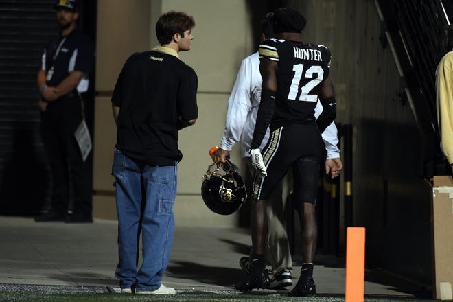 Colorado wide receiver Travis Hunter leaves the field during the second quarter of the game against Kansas State.