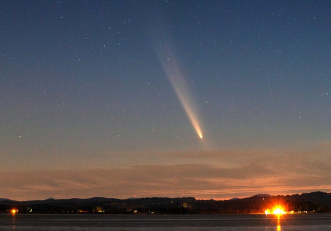 Comet Tsuchinshan-ATLAS appears over Fern Ridge Reservoir looking west from Orchard Point Park Sunday, Oct. 13, 2024.