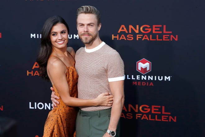 Hayley Erbert Hough, pictured with husband Derek Hough, returned to "Dancing with the Stars" on Tuesday night as the pair performed a contemporary routine to "Beautiful Things" by Benson Boone.