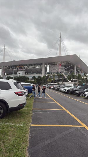 Fans arrive at Hard Rock Stadium in Miami Gardens for Night of Taylor Swift's Eras Tour.