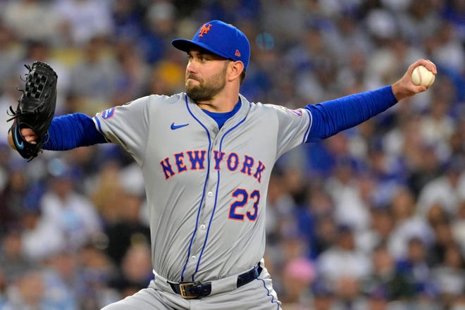 Oct 13, 2024; Los Angeles, California, USA; New York Mets pitcher David Peterson (23) throws a pitch against the Los Angeles Dodgers in the third inning during game one of the NLCS for the 2024 MLB Playoffs at Dodger Stadium. Mandatory Credit: Jayne Kamin-Oncea-Imagn Images