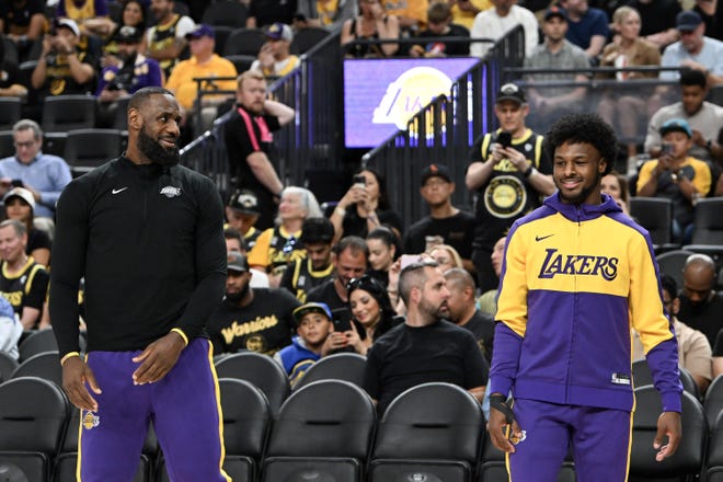 Los Angeles Lakers forward LeBron James (23) warms up with guard Bronny James (9) before the preseason game against the Golden State Warriors at T-Mobile Arena on Oct 15, 2024.