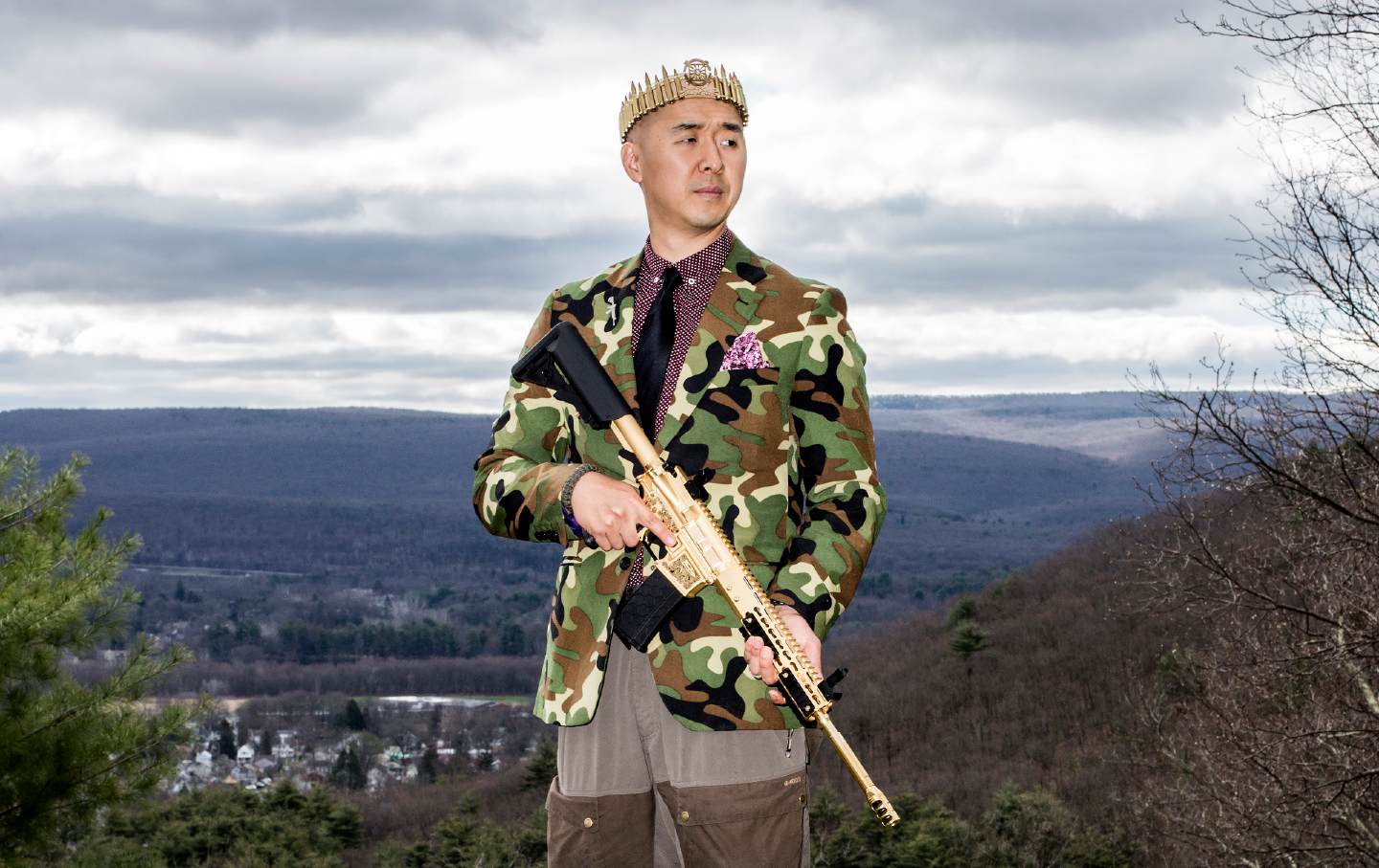 The Rev. Hyung Jin “Sean” Moon poses for a portrait with his gold AR-15 at Moon’s home in Matamoras, Pennsylvania, on April 26, 2018.