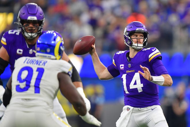 Minnesota Vikings quarterback Sam Darnold throws during the first half.