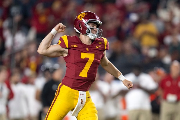 USC quarterback Miller Moss celebrates a touchdown during the first...