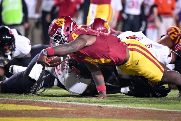 USC running back Woody Marks comes up just short of...