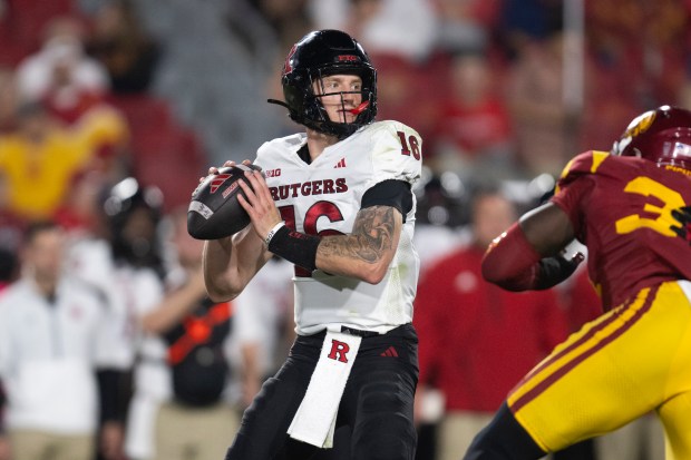 Rutgers quarterback Athan Kaliakmanis throws a pass during the first...