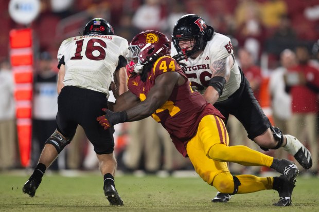 USC defensive end Sam Greene (44) sacks Rutgers quarterback Athan...