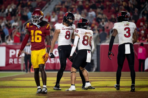 Rutgers running back Jordan Smikle (80) celebrates his touchdown with...