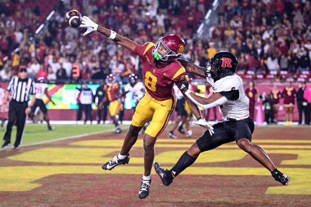 USC wide receiver Ja’Kobi Lane (8) can’t reach a pass...