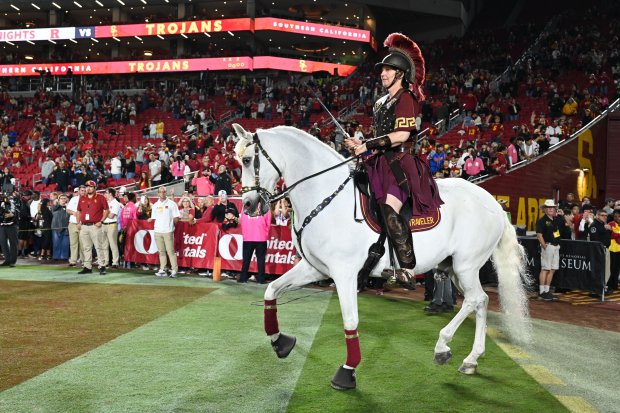 USC’s mascot, Traveler, takes the field before the start of...