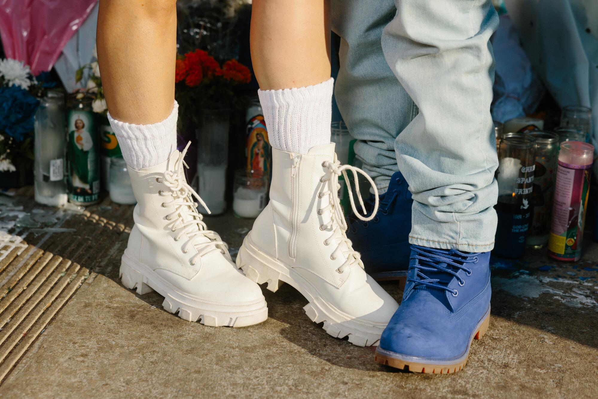  Andre and Margarita Daniels show off their white boots and blue boots at Dodger Stadium.