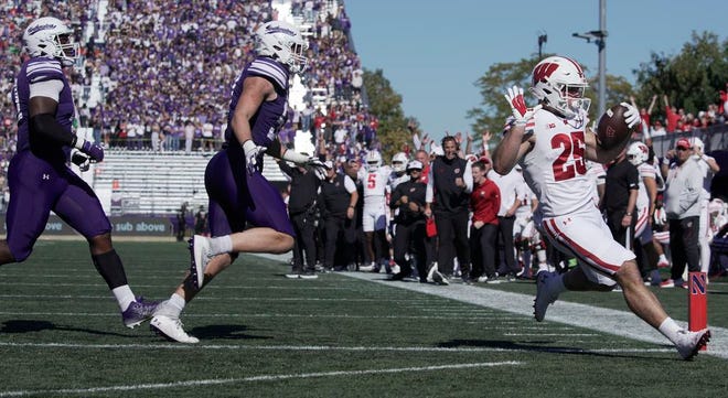 Wisconsin running back Cade Yacamelli (25) runs for a touchdown during the second quarter of their game against Northwestern Saturday October 19, 2024 at Lanny and Sharon Martin Stadium in Evanston, Illinois.