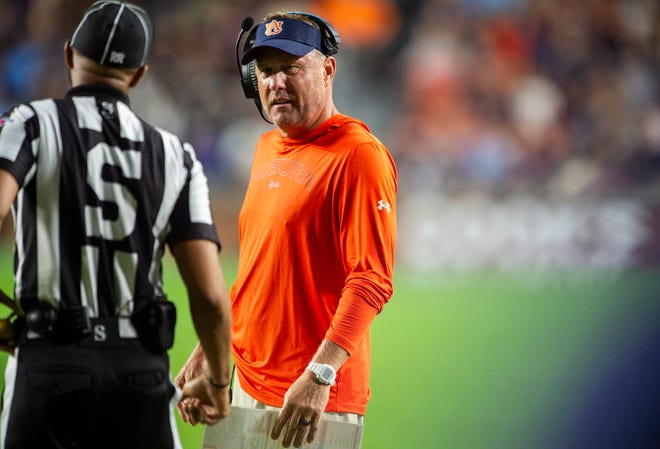 Auburn Tigers head coach Hugh Freeze talks with officials as Auburn Tigers take on New Mexico Lobos at Jordan-Hare Stadium in Auburn, Ala., on Saturday, Sept. 14, 2024. Auburn Tigers defeated New Mexico Lobos 45-19.