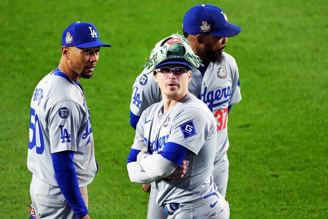 Oct 28, 2024; New York, New York, USA; Los Angeles Dodgers shortstop Mookie Betts (50), third baseman Enrique Hernandez (8) and outfielder Teoscar Hernandez (37) wait in the outfield for a pitching change during the seventh inning against the New York Yankees in game three of the 2024 MLB World Series at Yankee Stadium. Mandatory Credit: Robert Deutsch-Imagn Images