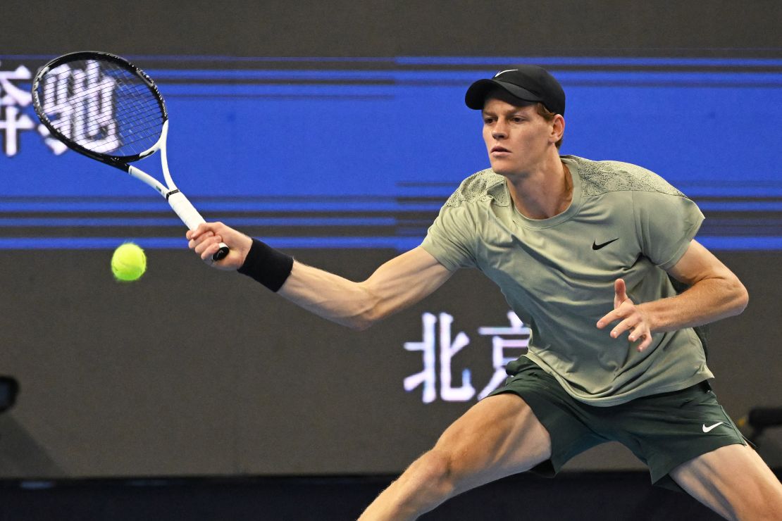 Italy's Jannik Sinner hits a return to Spain's Carlos Alcaraz during the men's singles final at the China Open tennis tournament in Beijing on October 2, 2024. (Photo by GREG BAKER / AFP) (Photo by GREG BAKER/AFP via Getty Images)