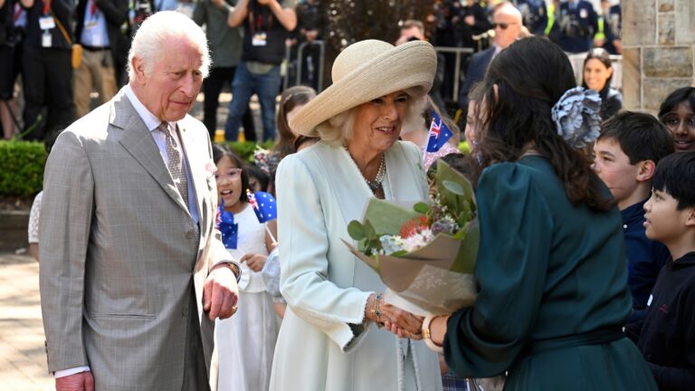 Children-greet-King-Charles-III-and-Queen-Camilla-outside-a.jpg