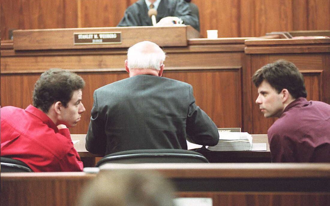 Erik (left) and Lyle Menendez talking in a Los Angeles courtroom on Feb. 2, 1995. 