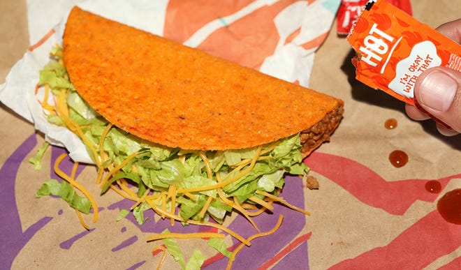 Nacho Cheese Doritos Locos Tacos are among the $1 deals Taco Bell has planned for National Taco Day on Oct. 1.