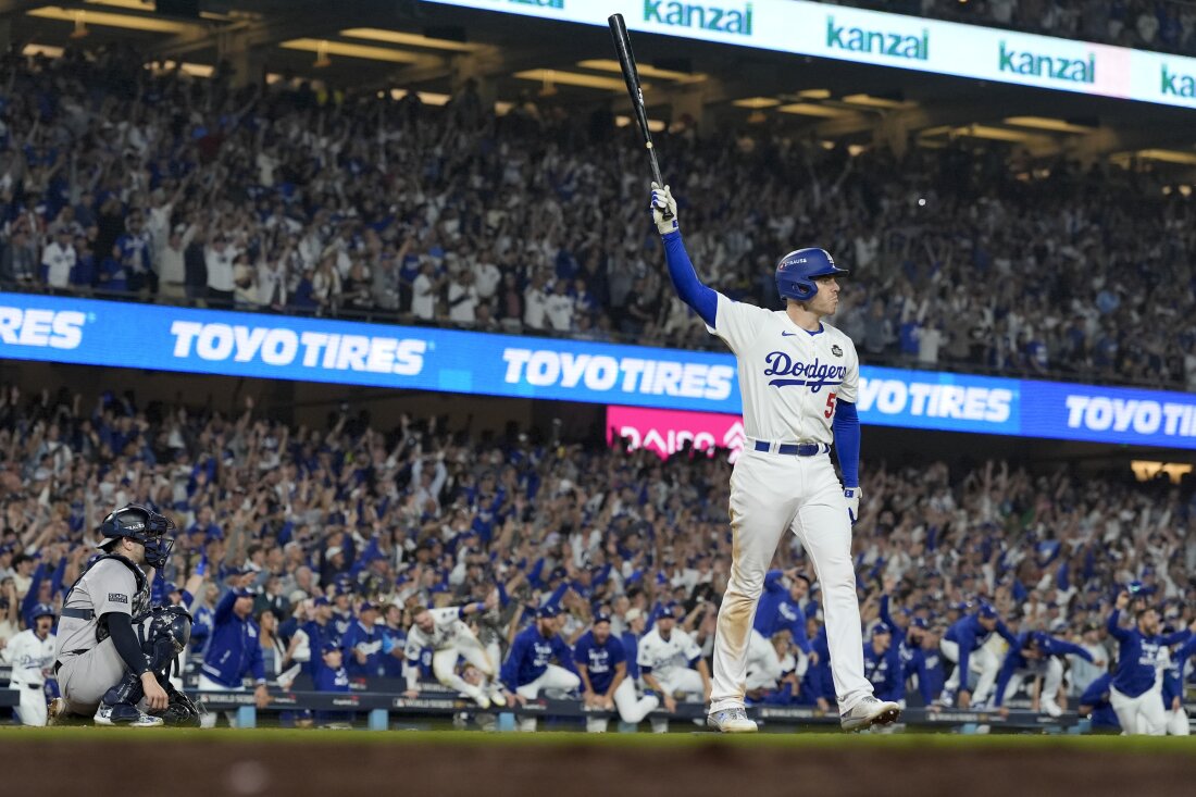 Los Angeles Dodgers' Freddie Freeman celebrates his walk-off grand slam home run against the New York Yankees during the 10th inning in Game 1 of the baseball World Series on Friday in Los Angeles.