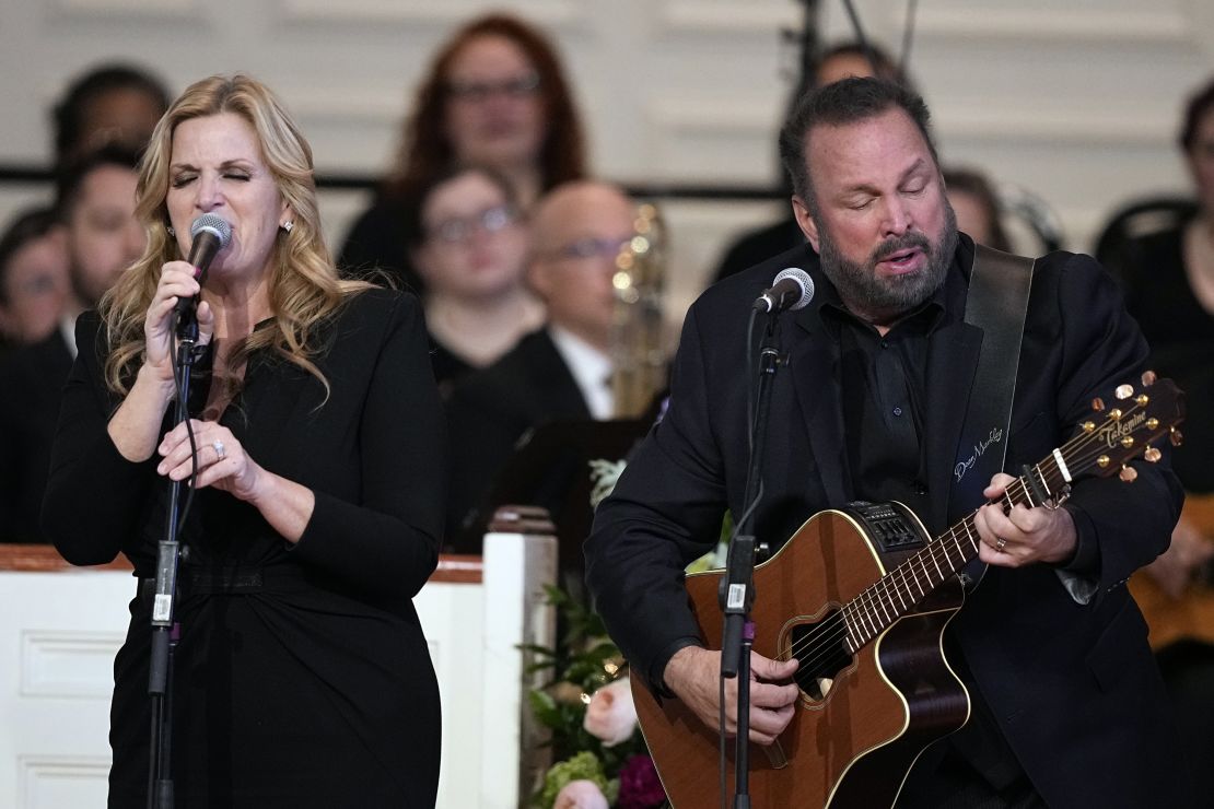 ATLANTA, GEORGIA - NOVEMBER 28: Trisha Yearwood and Garth Brooks perform 