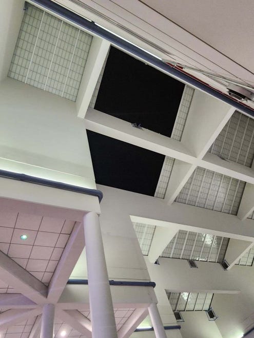 A view of the hole left by fallen pieces of a skylight ceiling in the terminal at Melbourne Orlando International Airport. No one was injured The ceiling was damaged around 2 a.m. Thursday (Oct. 10, 2024), as Hurricane Milton passed through Central Florida.