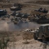 Tanks and troops gather in northern Israel on Monday in preparation for a ground invasion.