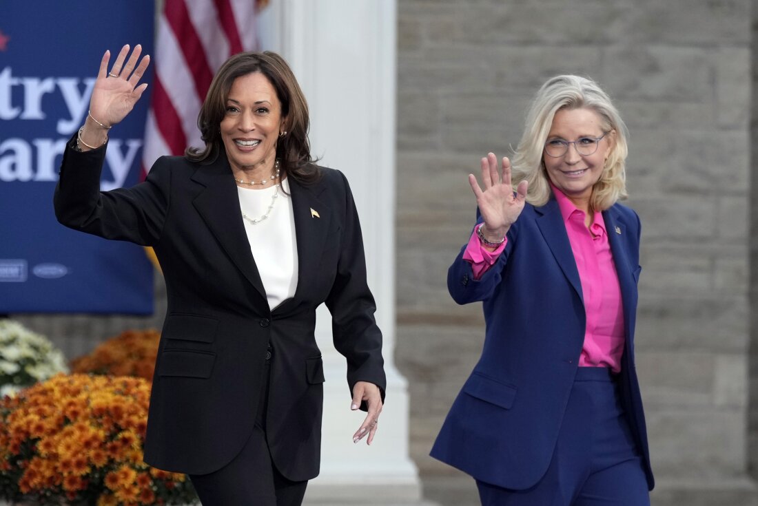 Vice President Harris walks with former Rep. Liz Cheney, R-Wyo., at a campaign rally in Ripon, Wis. on Oct. 3.