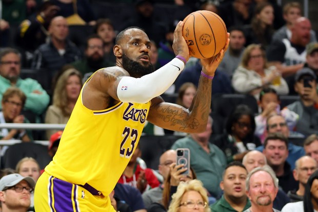 Lakers star LeBron James takes a shot during the first...