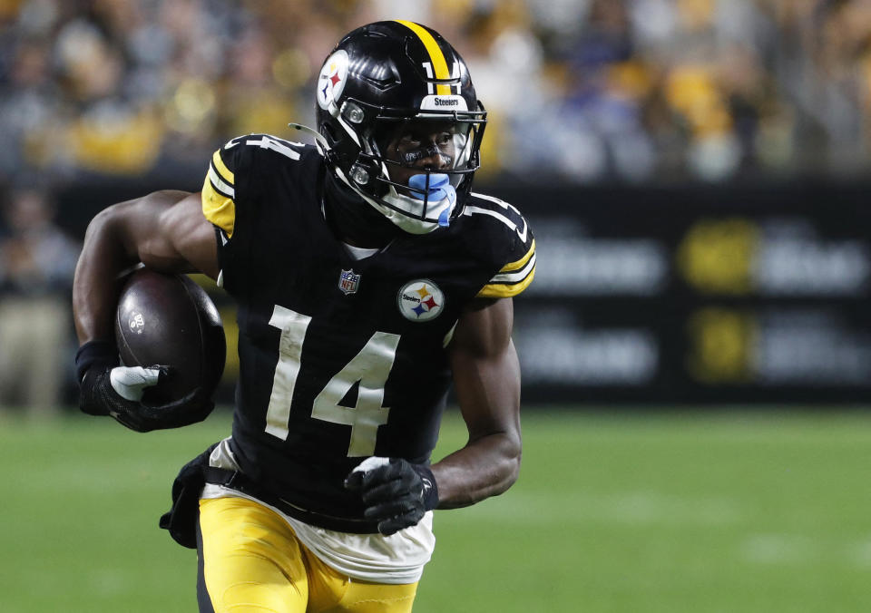 Oct 6, 2024; Pittsburgh, Pennsylvania, USA;  Pittsburgh Steelers wide receiver George Pickens (14) runs after a catch against the Dallas Cowboys during the fourth quarter at Acrisure Stadium. Dallas won 20-17. Mandatory Credit: Charles LeClaire-Imagn Images