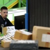 A U.S. Customs and Border Protection technician monitors overseas parcels as they get scanned at a mail inspection facility in Chicago.