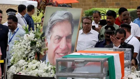 Reuters People pay their respects to the former chairman of Tata Group Ratan Tata, in Mumbai, India, October 10, 2024. 