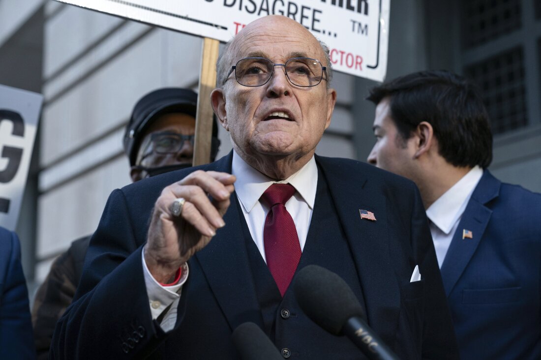 Rudy Giuliani speaks during a news conference outside federal court in Washington, Dec. 15, 2023.