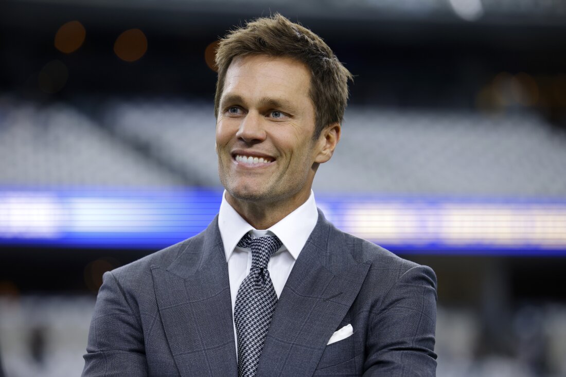 Fox Sports lead NFL analyst Tom Brady stands on the field during warmups before a game between the Detroit Lions and the Dallas Cowboys in Arlington, Texas, on Sunday. 